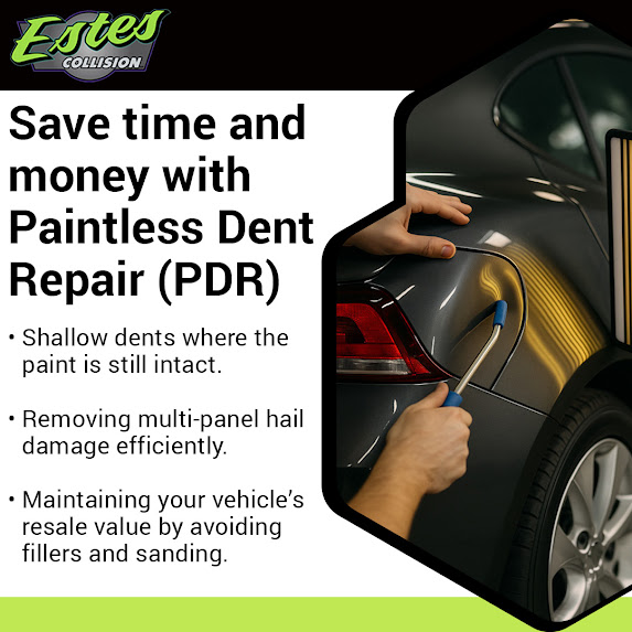 Technician performing paintless dent repair on a dark gray vehicle to remove hail damage and shallow dents without repainting