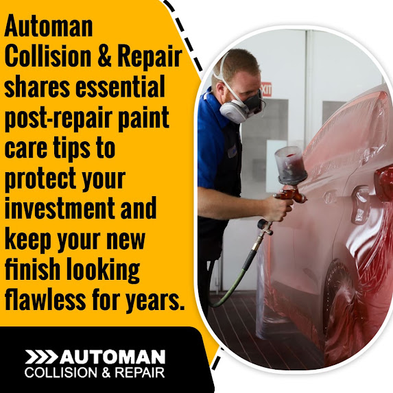 Auto body technician applying paint to vehicle panel in controlled spray booth