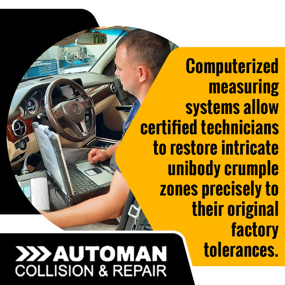 A technician running computerized diagnostics inside a vehicle to repair unibody crumple zones to original factory tolerances.
