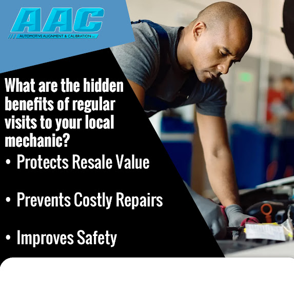 Auto mechanic performing routine vehicle maintenance and inspection under the hood