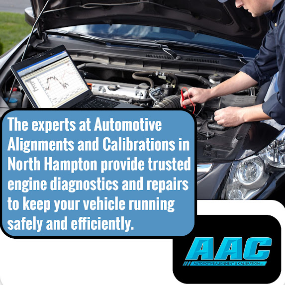 Mechanic performing engine diagnostics and battery testing on a vehicle at an auto repair shop in North Hampton