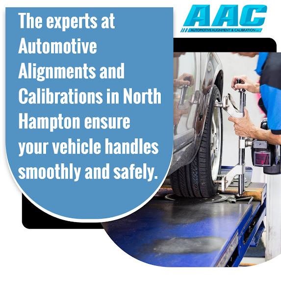 Technician performing wheel alignment adjustment on a vehicle at an auto shop in North Hampton